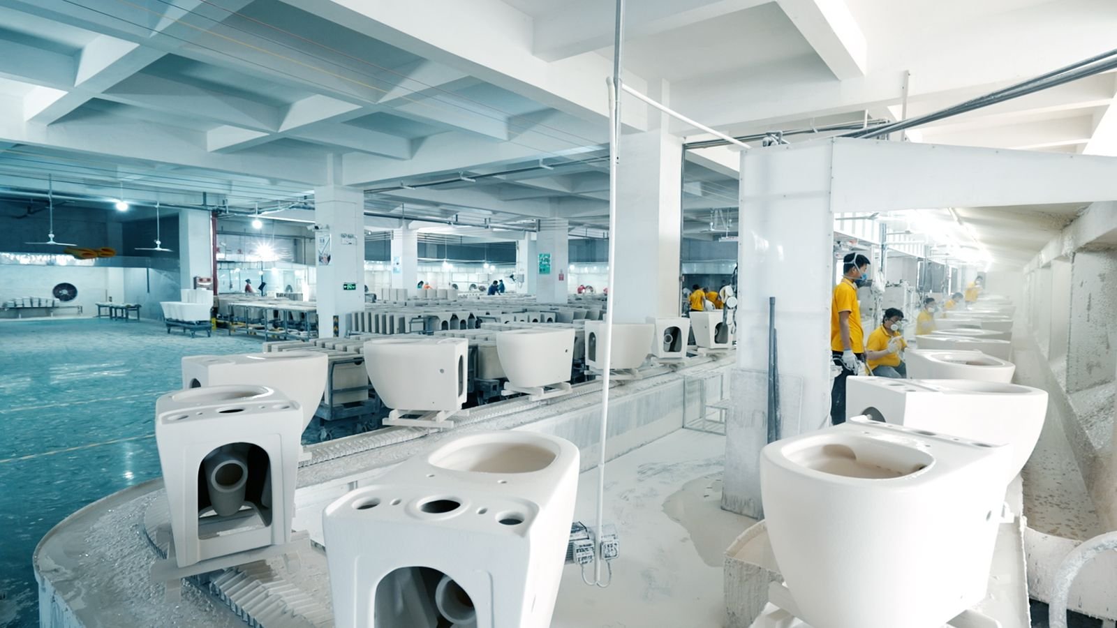 Spray-glazing line inside the Sheng Ge ceramic sanitaryware plant in Chaozhou, China